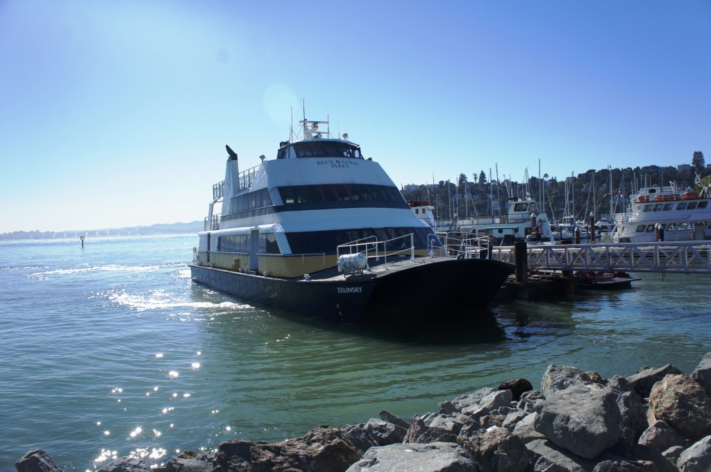 Blue and Gold ferry pulling up to the dock
